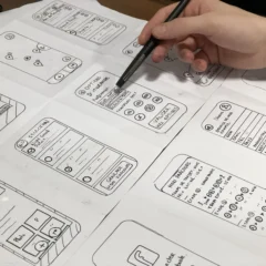 Design student sketching with pen on paper