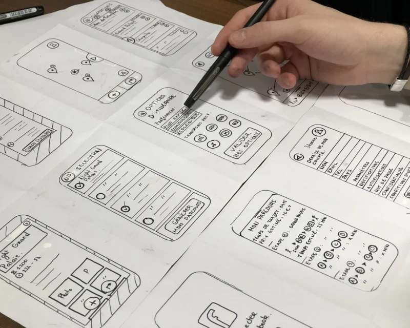 Design student sketching with pen on paper