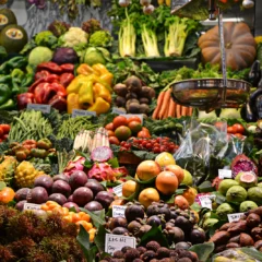 Colorful fresh fruits and vegetables at a market stall