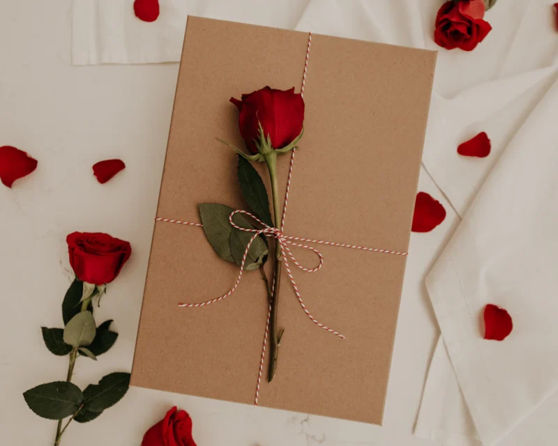 Gift box filled with red roses for Valentine's Day